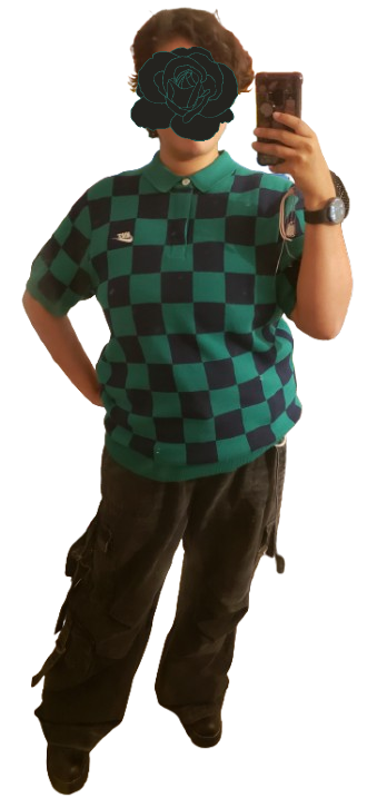 a checkered green and dark blue shirt with baggy black pants