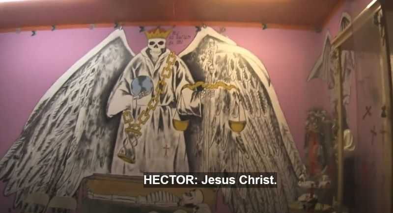 wall painting of a skeleton with angel wings, hold earth in one hand, and on the other hand holding a justice balance. i hope that is what they are called.
