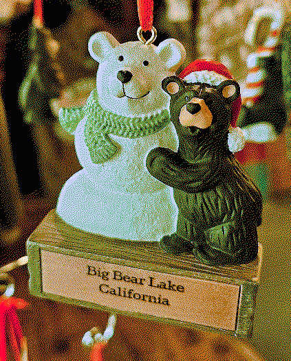tree decoration of two bears. one of the bears is snow and the other one is hugging him.
