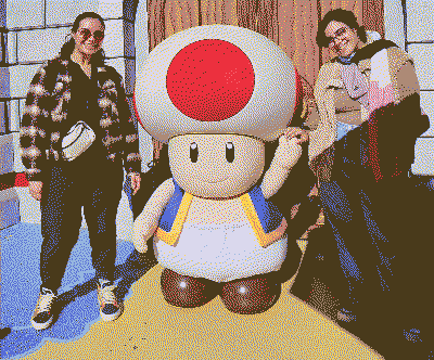 my sister, toad from super mario, and me. i am holding toad's hand